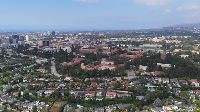 University of California Los Angeles UCLA flying towards Westwood Village Bel Air homes and Wilshire Corridor skyline on Westside