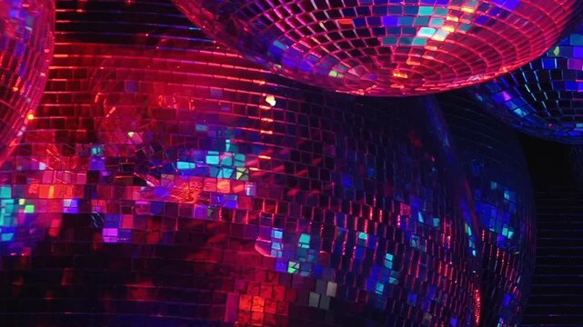 Gleaming disco balls hang suspended, reflecting a mesmerizing dance of vivid hues.