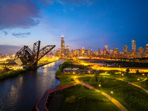  Aerial View of Downtown Chicago Skyline at Dusk with Chicago River, Open Drawbridge and City Lights