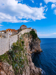 Naklejka premium Aerial view and the panorama view of Dubrovnik City Wall and the old town on a beautiful clear sky and blue Adraitic sea, Croatia 