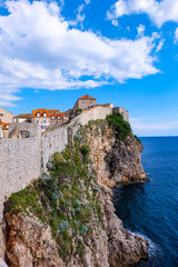 Naklejka premium Aerial view and the panorama view of Dubrovnik City Wall and the old town on a beautiful clear sky and blue Adraitic sea, Croatia 