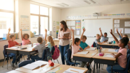Fototapeta premium Blurred teacher and diverse elementary students raising hands in a bright classroom for educational website backgrounds, academic marketing campaigns, and digital teaching presentations