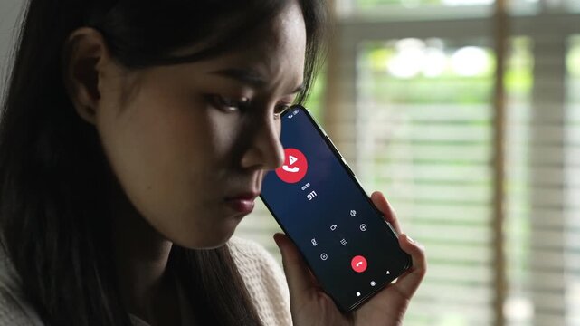 Woman calling emergency number 911 for crisis situation