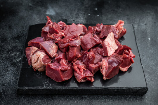 Fresh chopped pork heart pieces prepared for cooking, ideal for hearty stews, saute recipes and gourmet offal cuisine.