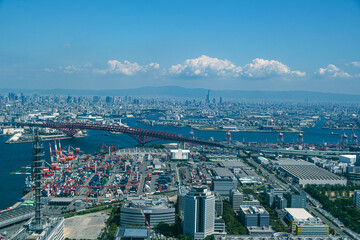 Aerial View of Osaka Port Container Terminal with Red Arch Bridge and City Skyline © 영화 최