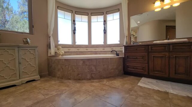 Cozy bathroom with curved bay window and warm light