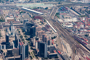 Fototapeta premium Naples, Campania, Italy, aerial view of the city the Centro Direzionale skyscrapers, extensive Napoli Centrale railway station, and vast rail yard infrastructure