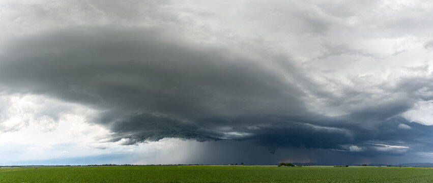 Powerful storm clouds gathering over Bavaria Germany panoramic view of threatening weather with dark ominous atmosphere