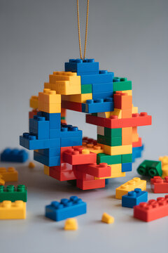 LEGO pieces forming broken ornament with gaps and shifts creating abstract fragmented pattern