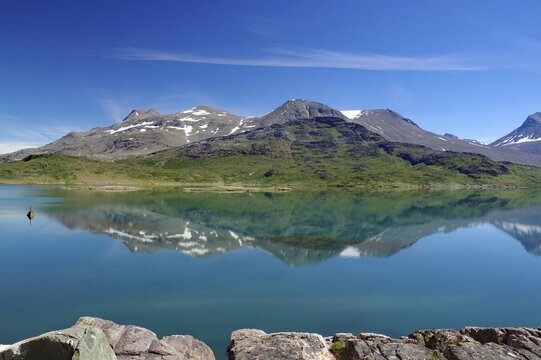 Mountains reflected in a fjord in a barren landscape, Igaliku, North America, Greenland, Denmark