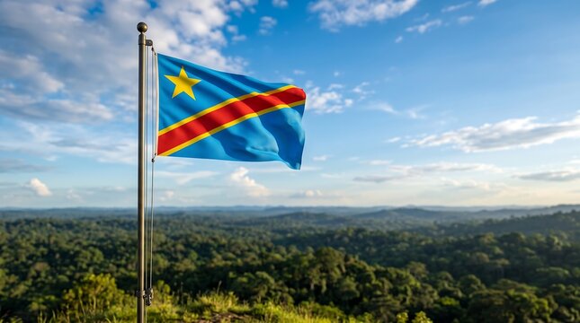 National flag of Democratic Republic of the Congo waving on metal pole over lush tropical forest landscape