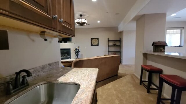Open Plan Kitchen and Living Area with Marble Countertop