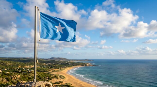National flag of Somalia on flagpole overlooking a tropical beach coastline under a blue cloudy sky
