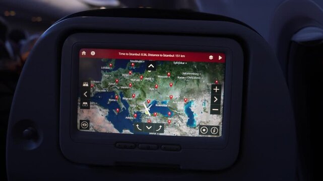In-flight entertainment screen displays flight path and map of Europe, showing estimated arrival time and distance to Istanbul