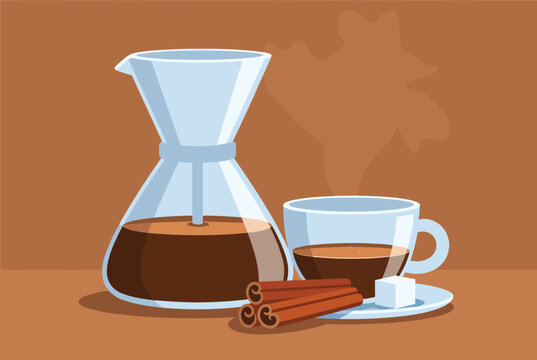 Glass pour-over coffee maker and a matching cup with coffee served alongside cinnamon sticks and a sugar cube.