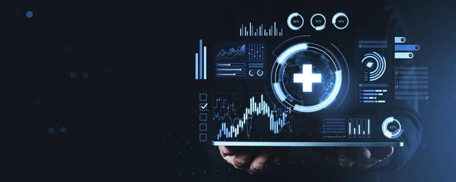 Digital healthcare dashboard with glowing medical cross and analytics data interface held in hands on dark business technology background.