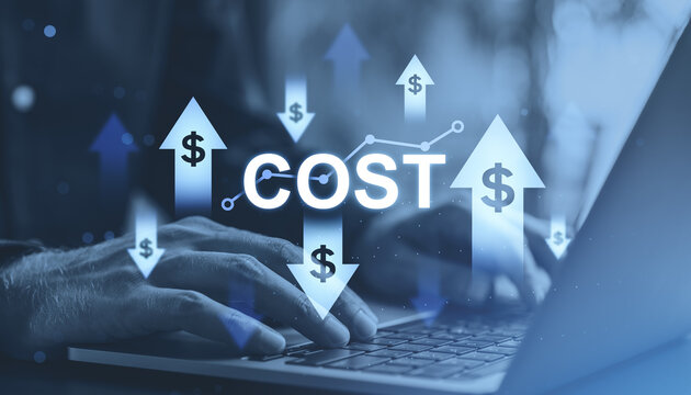 Hands typing on laptop with glowing cost indicators and rising arrows symbolizing financial changes in a modern business environment.