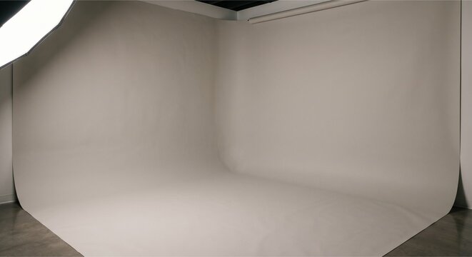 Professional photography studio setup with white seamless paper backdrop and lighting equipment for product shoot