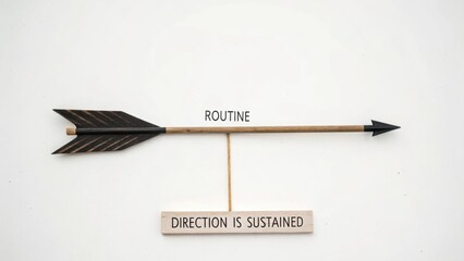 Naklejka premium Arrow with Inspirational Message on Routine and Direction Sustainment for Motivational Stock Imagery