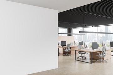 Obraz premium Blank wall in modern office interior with empty poster mockup beside open workspace and clean desks in contemporary design ready for creative layout display. 3D Rendering