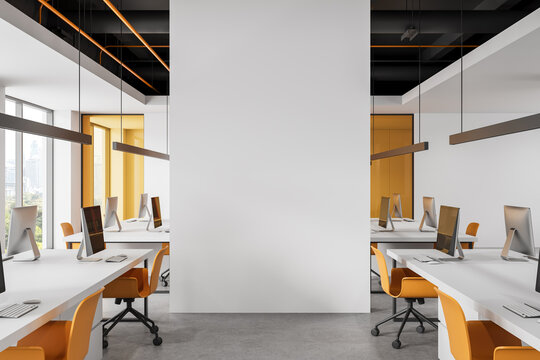 Modern interior office workspace with blank central wall mockup for clean design display in bright contemporary layout setting. 3D Rendering