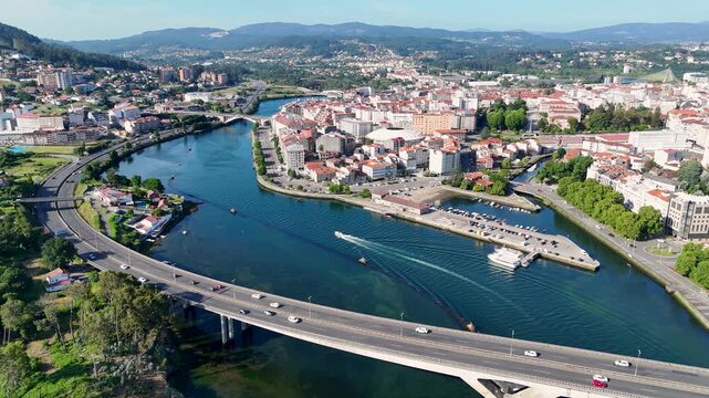 Aerial view of Pontevedra city with traffic crossing the Rande Bridge