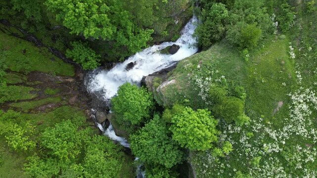 Europe, Italy, Alpeggio Balma di Rodoretto , Prali , Turin is a small mountain village with a stream of water due to the melting of the glacier ice - climate change and global warming save the planet