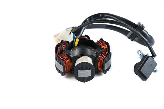 Motorcycle magneto stator core with copper winding coils and pulse sensor isolated.
