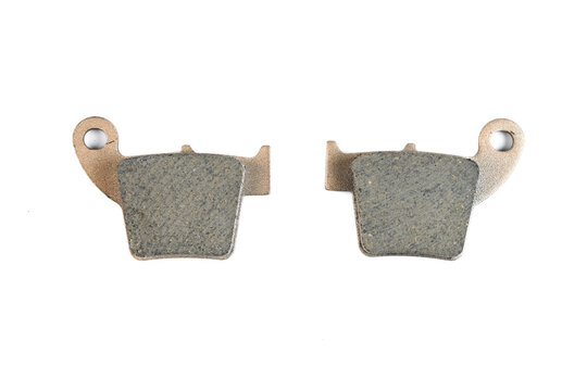 Motorcycle sintered disc brake pad set with copper backing plate isolated top view.