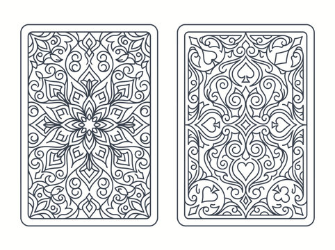 Ornate playing card back designs with floral and suit patterns