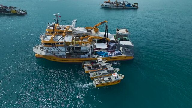 Aerial Video of Work Boats Along Rocky Mediterranean Coast