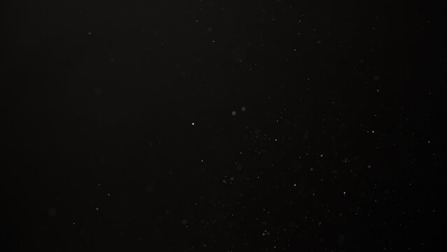 Slow motion real dust flow over dark background