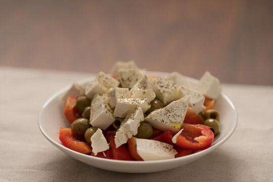 Greek style salad with tomatoes, bell pepper, olives and feta cheese