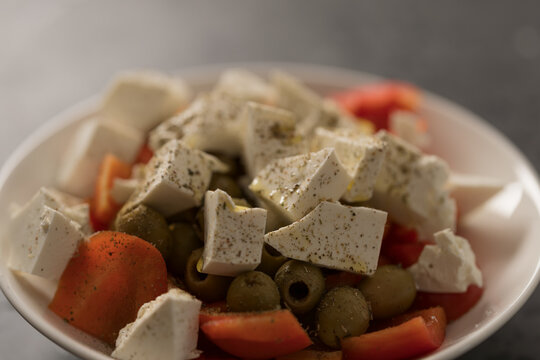 Greek style salad with tomatoes, bell pepper, olives and feta cheese