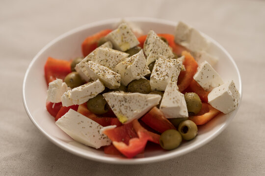 Greek style salad with tomatoes, bell pepper, olives and feta cheese