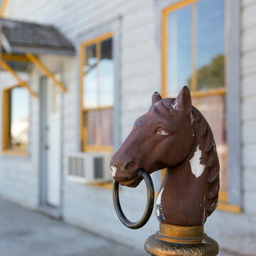 Horse hitching post outside an old western building