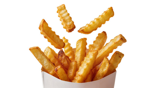 Isolated hot crispy crinkle cut french fries dropping into a paper food container.