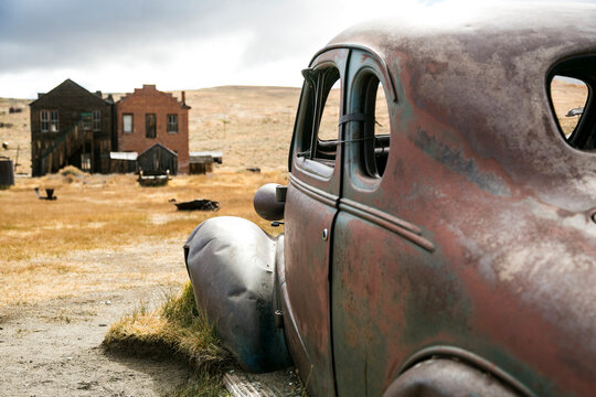 Vintage car beside buildings in a western ghost town
