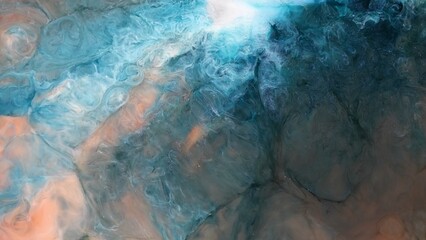 Naklejka premium Art created with alcohol ink shows abstract patterns in blue and orange during a creative session