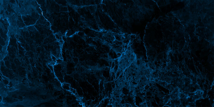A close-up macro shot showcases the intricate, abstract patterns of dark blue marble, highlighting its natural veining and polished texture.