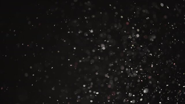 Slow motion real dust wave flow over dark background