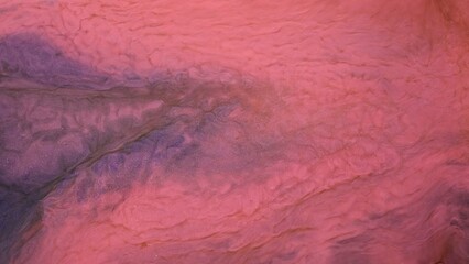 Naklejka premium Exploring alcohol ink techniques through video art with a focus on abstract forms and colors