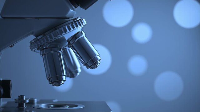 Laboratory microscope objectives against a blue bokeh background, symbolizing scientific research and medical technology, close-up.