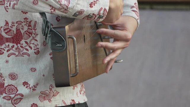 Kantele, playing, musician's hands close-up performing traditional folk music