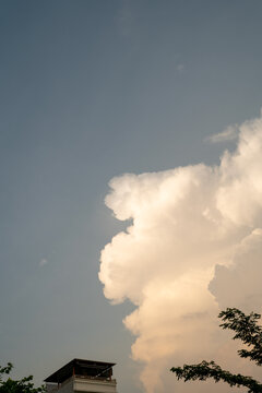 A serene sky showcasing fluffy white clouds against a soft blue backdrop.