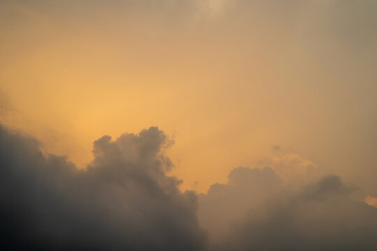 Soft orange clouds against a serene twilight sky.