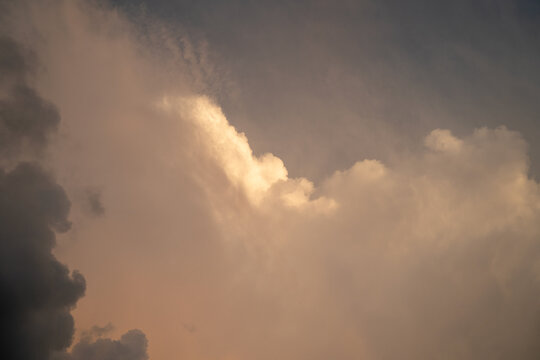 Dramatic sunset clouds with a blend of warm and cool tones.