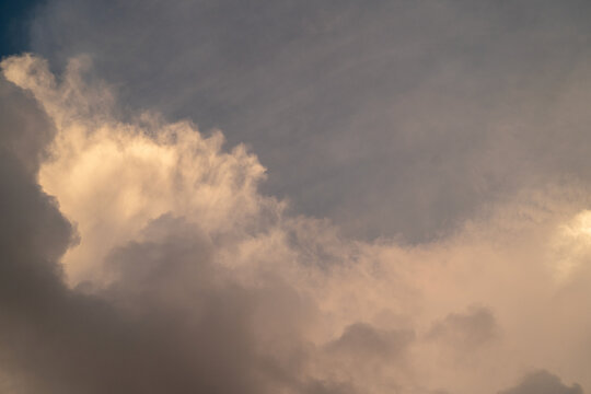 Dramatic clouds with soft hues during twilight, creating a serene atmosphere.
