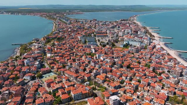 Nessebar old town peninsula panoramic aerial drone view red roofs traditional houses sandy beaches blue Black Sea coast summer travel Bulgaria