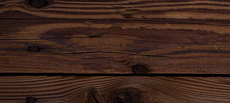 Beautiful dark brown wood texture with rich grain and circular knots for interior design backgrounds and carpentry projects featuring polished timber surface and elegant natural pattern aesthetics